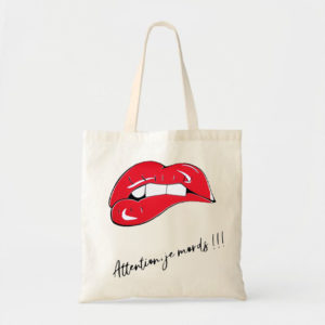 tote bag avec flocage d'une bouche rouge et attention je mords