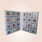 calendrier de l'avent gris en forme de livre avec boites cadeaux pour noel