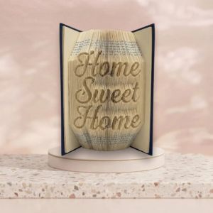 Sculpture sur livre plié formant le texte manuscrit Home Sweet Home pour une décoration d'intérieur chaleureuse.